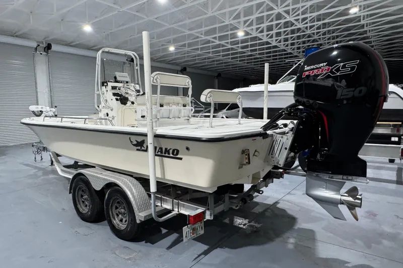 Slide: The Image of 2017 Mako 21 LTS boat with Mercury Pro XS 150 engine in a showroom. - 2