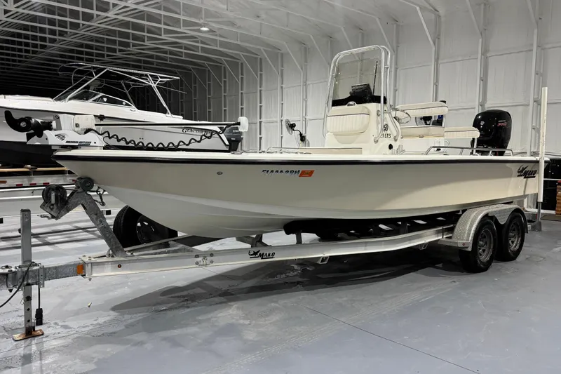 Slide: The Image of 2017 Mako 21 LTS boat on trailer in indoor storage facility. - 4