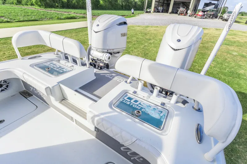 Slide: The Image of 2022 Costa Custom Boats 264 HC with Yamaha engines, showcased outdoors. - 14