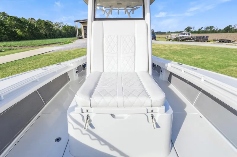 Slide: The Image of 2022 Costa Custom Boats 264 HC interior with white cushioned seating. - 15