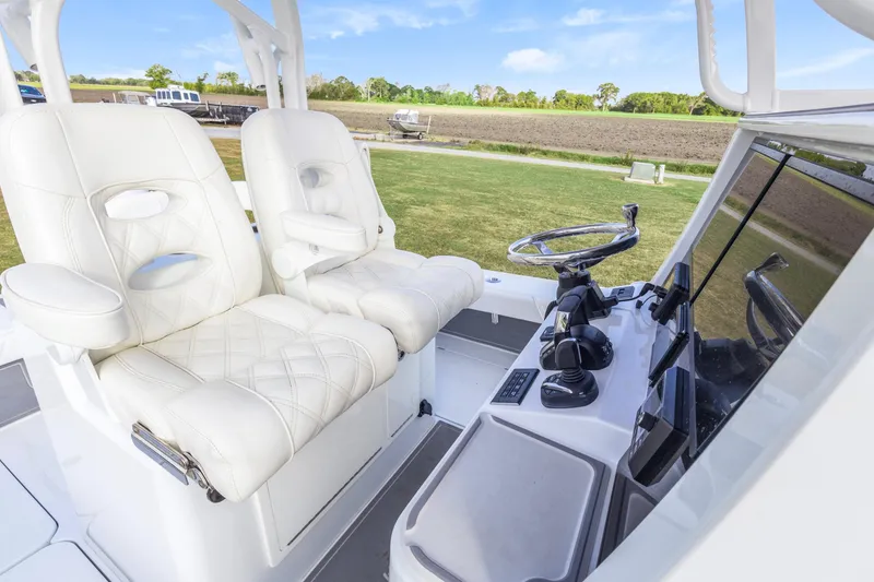 Slide: The Image of Luxurious interior of 2022 Costa Custom Boats 264 HC with plush seating and modern controls. - 16