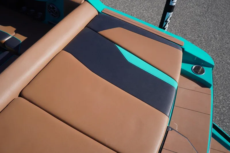 Slide: The Image of 2023 Axis T235 boat interior with brown and teal upholstery design. - 11
