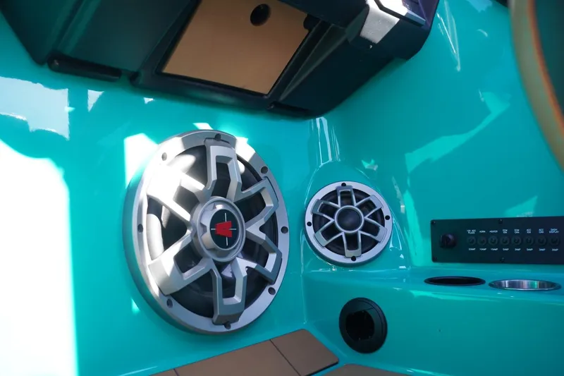Slide: The Image of 2023 Axis T235 boat interior with speakers and control panel. - 19