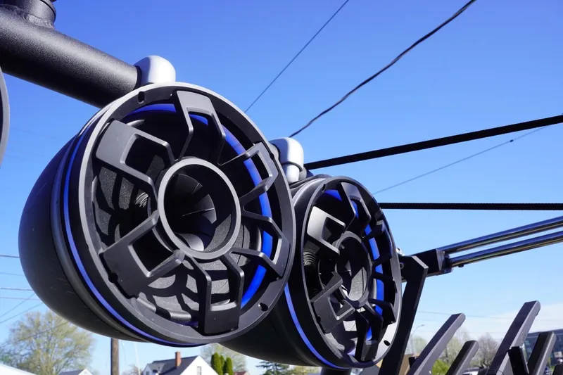 Slide: The Image of 2023 Axis T235 boat speakers against a clear blue sky. - 20