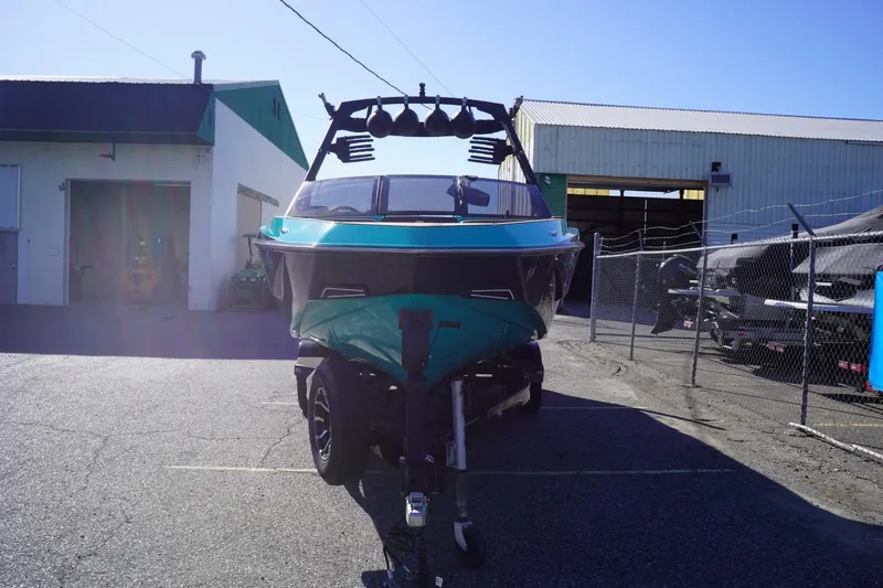 Slide: The Image of 2023 Axis T235 boat on trailer outside industrial building. - 4