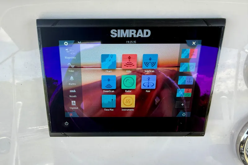 Slide: The Image of Simrad display on 2023 Key West 188 Bay Reef boat, showing navigation and radar options. - 18