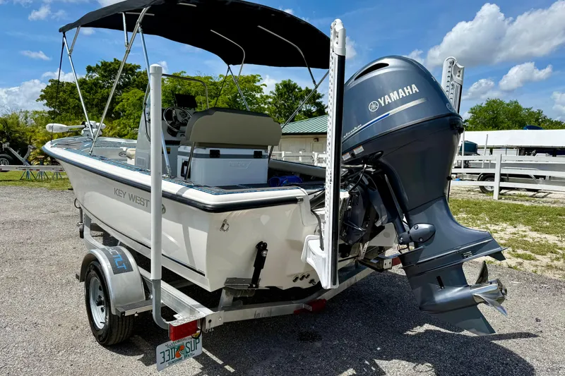 Slide: The Image of 2023 Key West 188 Bay Reef boat with Yamaha outboard motor on a trailer. - 28