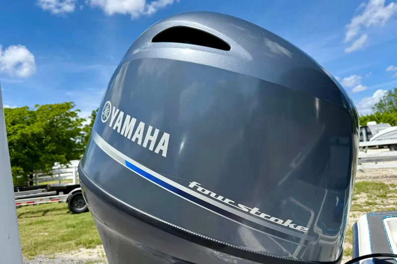 Slide: The Image of Yamaha four-stroke outboard motor on 2023 Key West 188 Bay Reef boat, sunny day. - 33