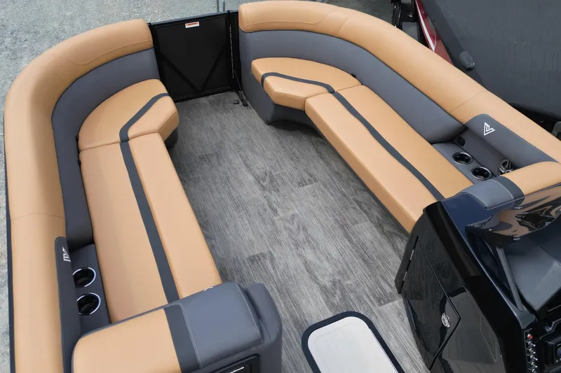 Slide: The Image of Luxurious seating on 2025 Viaggio Lago X-U 24 pontoon boat, featuring tan and gray upholstery. - 17