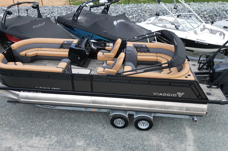Slide: The Image of 2025 Viaggio Lago X-U 24 pontoon boat with luxurious seating and sleek design. - 18