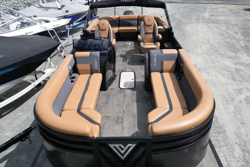 Slide: The Image of 2025 Viaggio Lago X-U 24 pontoon boat with tan and gray seating. - 7