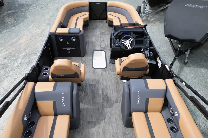 Slide: The Image of 2025 Viaggio Lago X-U 24 pontoon boat interior with luxurious seating and modern dashboard. - 9