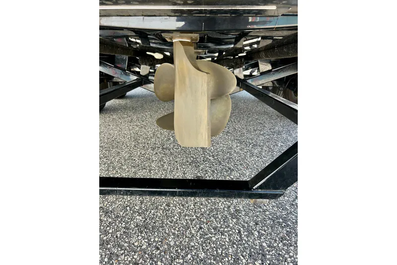 Slide: The Image of Propeller of 2021 MasterCraft NXT24 boat on trailer, close-up view. - 15