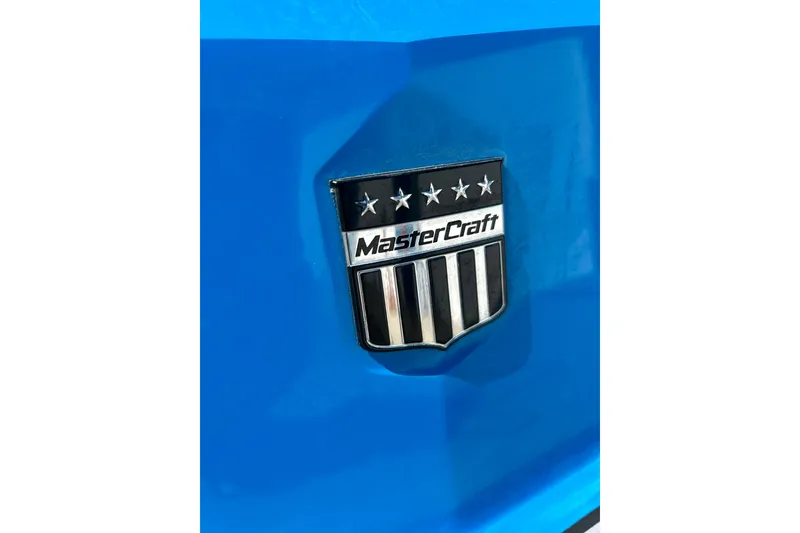 Slide: The Image of 2021 MasterCraft NXT24 logo on a vibrant blue background. - 19