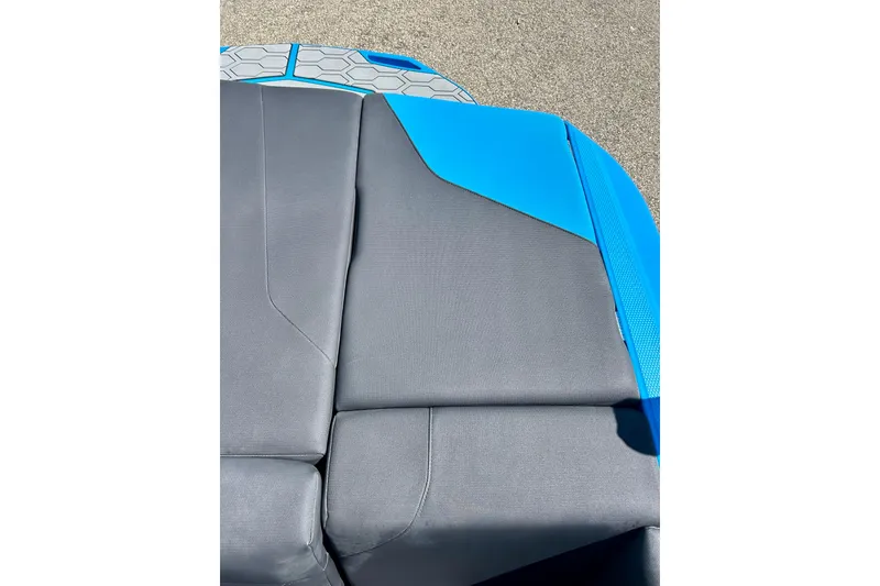 Slide: The Image of 2021 MasterCraft NXT24 boat seat with gray and blue upholstery detail. - 21