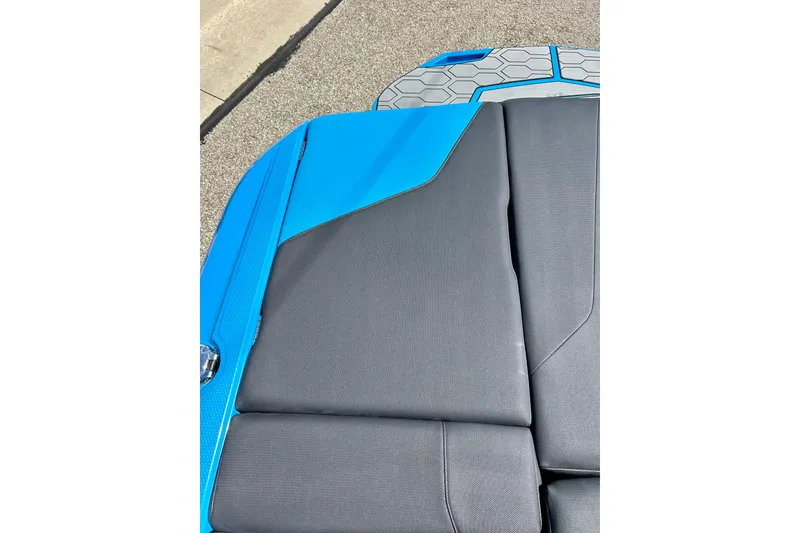 Slide: The Image of 2021 MasterCraft NXT24 boat interior with blue and gray upholstery detail. - 26