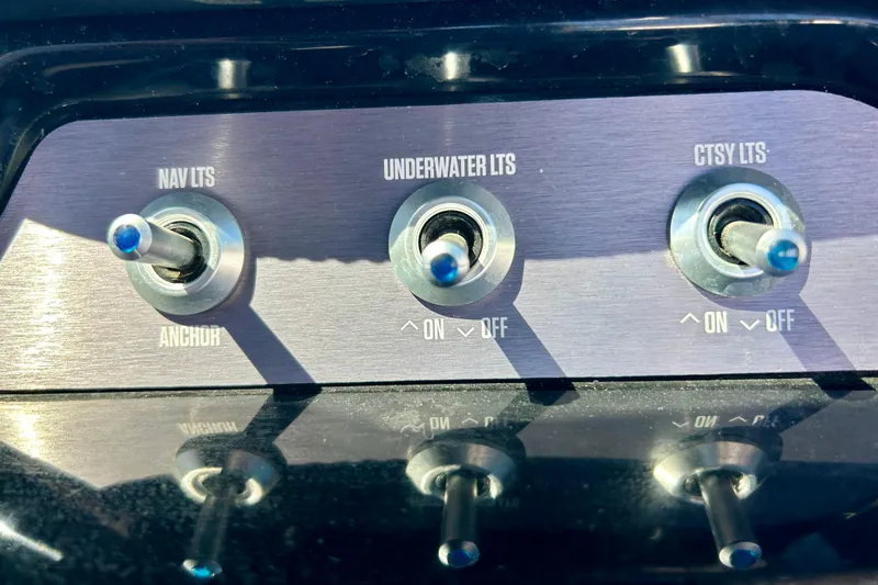 Slide: The Image of Switch panel of a 2021 MasterCraft NXT24 boat with lighting controls. - 31