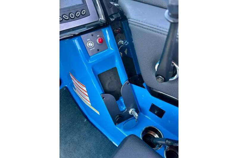 Slide: The Image of 2021 MasterCraft NXT24 boat interior dashboard with controls and cup holders. - 33