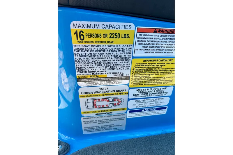 Slide: The Image of 2021 MasterCraft NXT24 capacity label detailing maximum load and safety compliance information. - 34