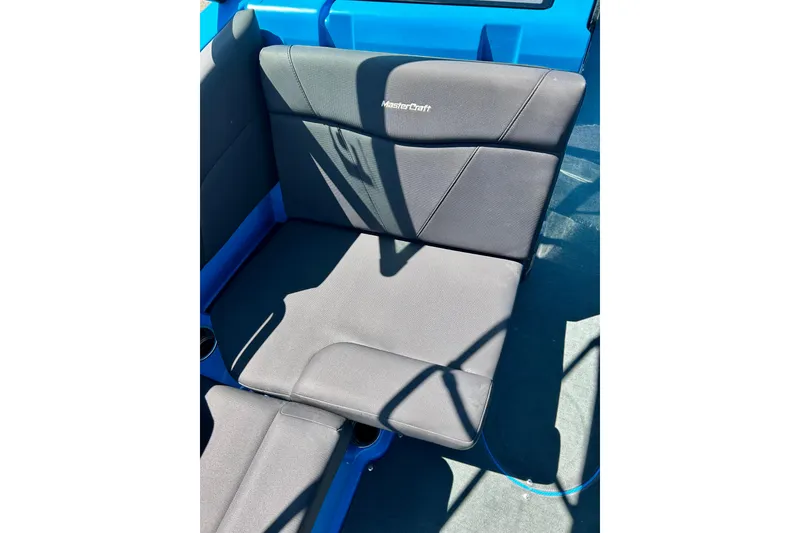 Slide: The Image of 2021 MasterCraft NXT24 boat seat in blue and black upholstery. - 35