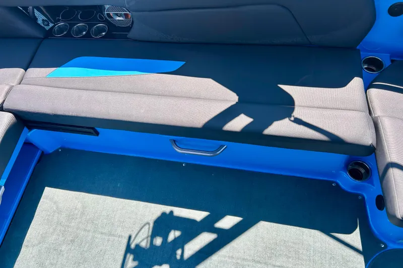 Slide: The Image of Interior seating of 2021 MasterCraft NXT24 boat with blue and black upholstery. - 37