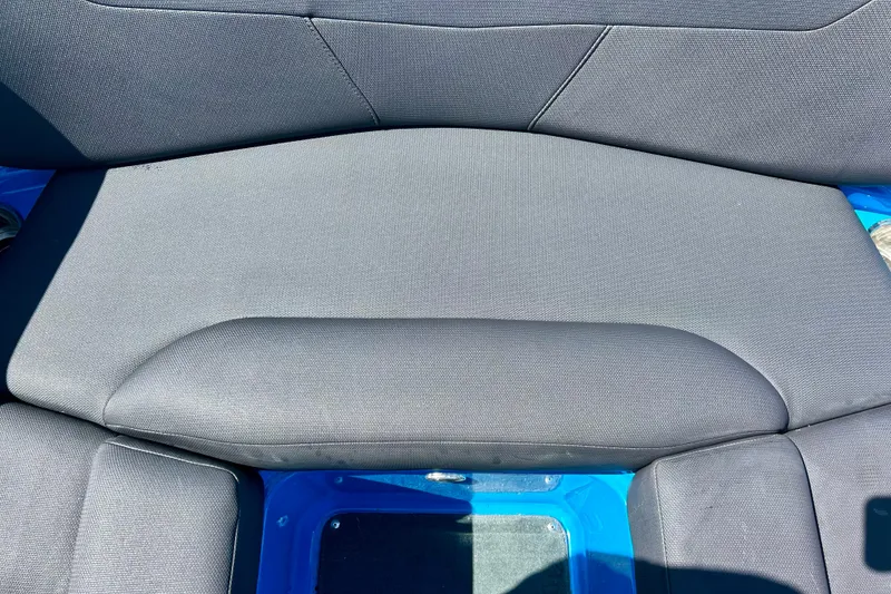 Slide: The Image of 2021 MasterCraft NXT24 boat seat with gray upholstery and blue accents. - 45