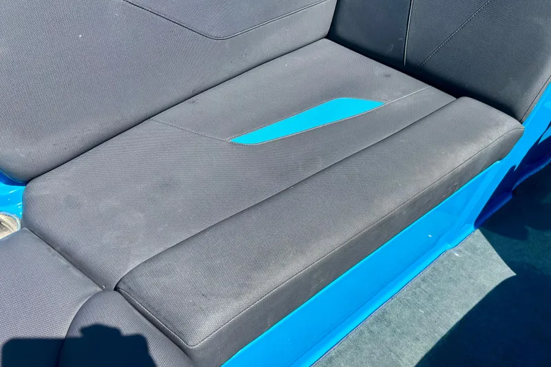 Slide: The Image of 2021 MasterCraft NXT24 boat seat with black and blue upholstery. - 46