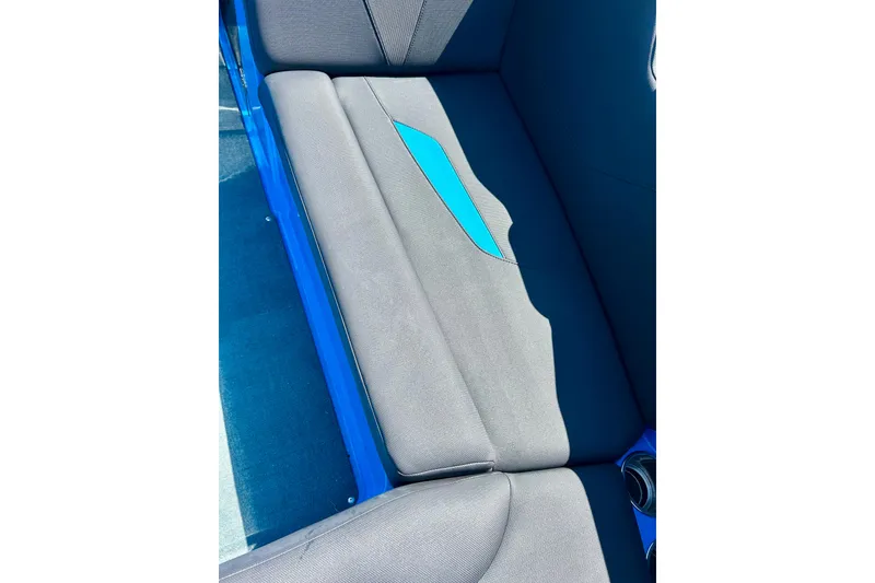Slide: The Image of 2021 MasterCraft NXT24 boat interior with gray and blue seating. - 48