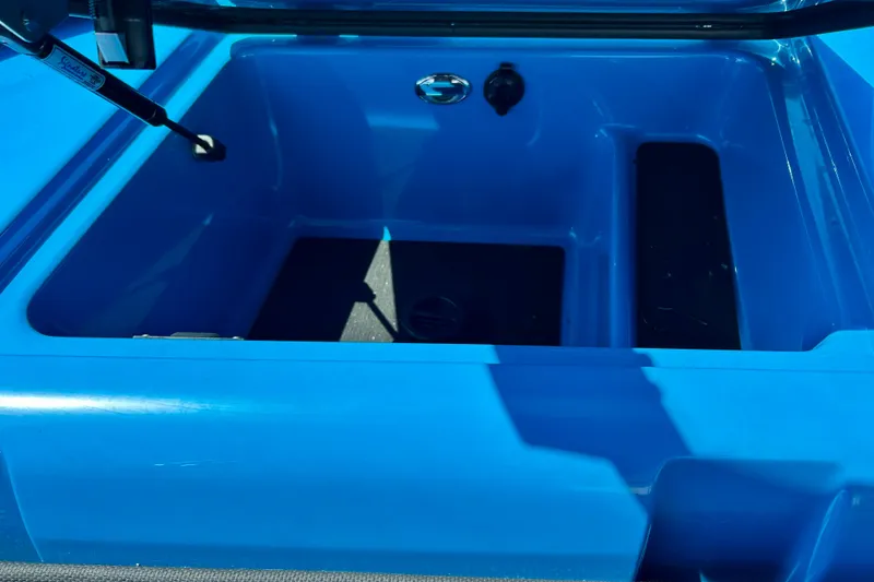 Slide: The Image of 2021 MasterCraft NXT24 boat storage compartment in vibrant blue. - 52