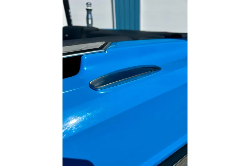Slide: The Image of 2021 MasterCraft NXT24 boat detail in vibrant blue finish. - 64