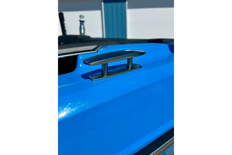 Slide: The Image of 2021 MasterCraft NXT24 boat cleat on vibrant blue hull. - 65