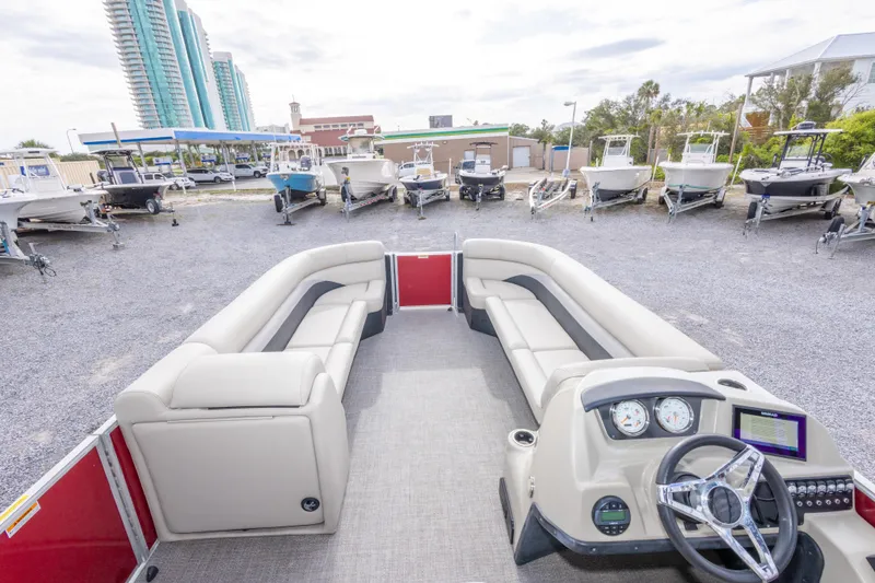 Slide: The Image of 2021 Barletta C24UC pontoon boat interior with plush seating and modern dashboard. - 30