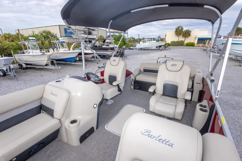Slide: The Image of 2021 Barletta C24UC pontoon boat interior with plush seating and modern design. - 34