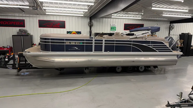 The Image of 2018 Bennington 25GSRCFB SPS TRI pontoon boat in warehouse. - 1
