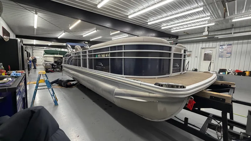 Slide: The Image of 2018 Bennington 25GSRCFB SPS TRI pontoon boat in workshop. - 3