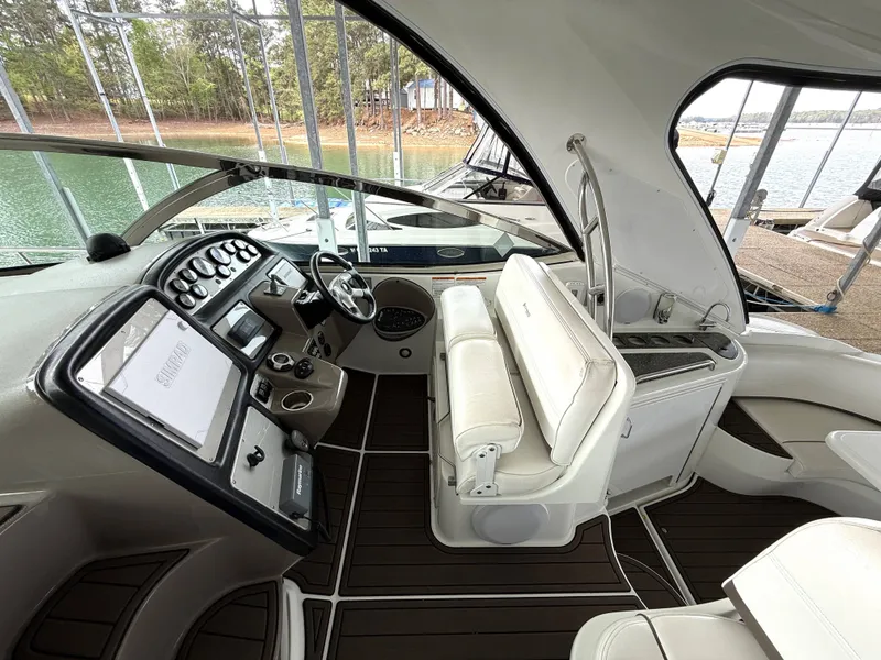Slide: The Image of Interior of a 2008 Cruiser Yachts 420 with helm and seating area. - 12