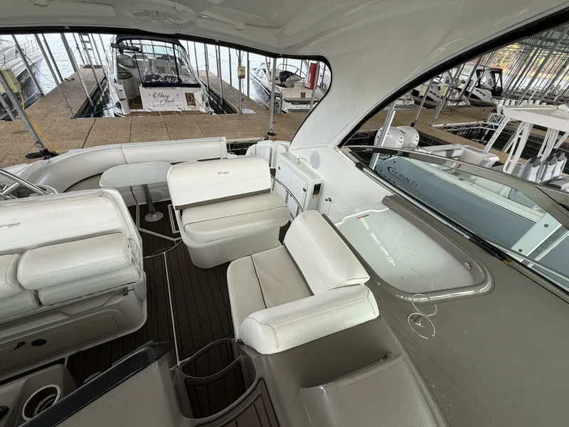 Slide: The Image of Interior of a 2008 Cruiser Yachts 420 with white leather seating. - 16