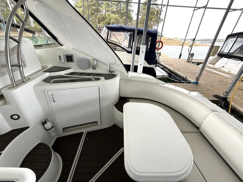 Slide: The Image of Interior of a 2008 Cruiser Yachts 420 with seating area and table. - 17