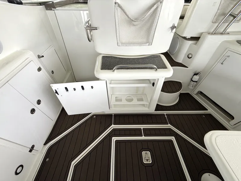 Slide: The Image of Interior of a 2008 Cruiser Yachts 420 with storage and wood flooring. - 22