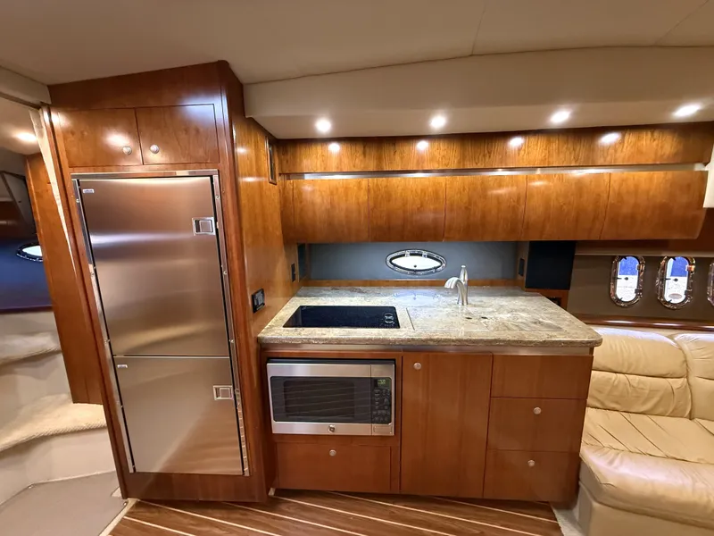 Slide: The Image of Interior of 2008 Cruiser Yachts 420 featuring modern kitchen. - 23