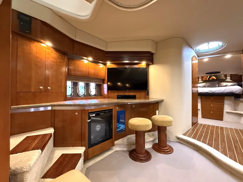 Slide: The Image of Interior of a 2008 Cruiser Yachts 420 with modern kitchen and seating area. - 26