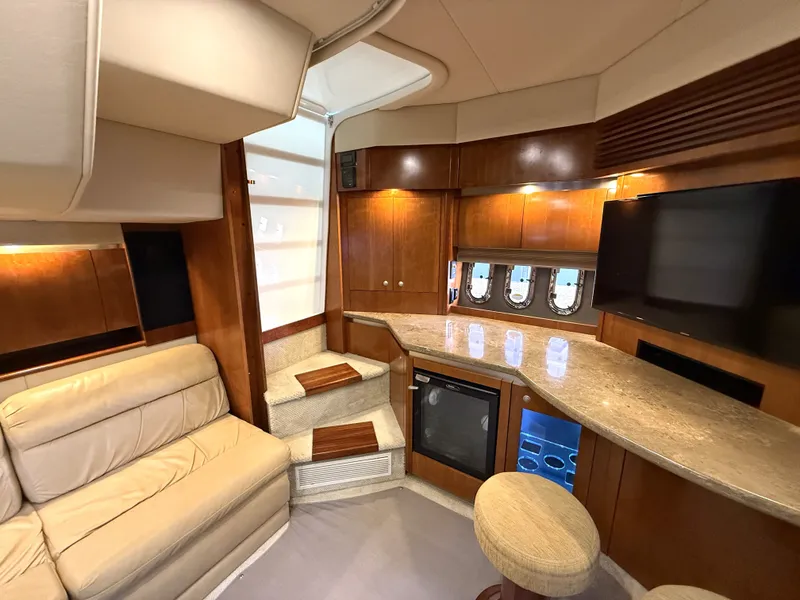 Slide: The Image of Interior of 2008 Cruiser Yachts 420 with leather sofa and kitchenette. - 29