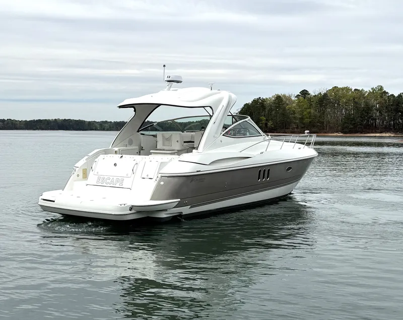 Slide: The Image of 2008 Cruiser Yachts 420 on calm water, wooded background. - 3