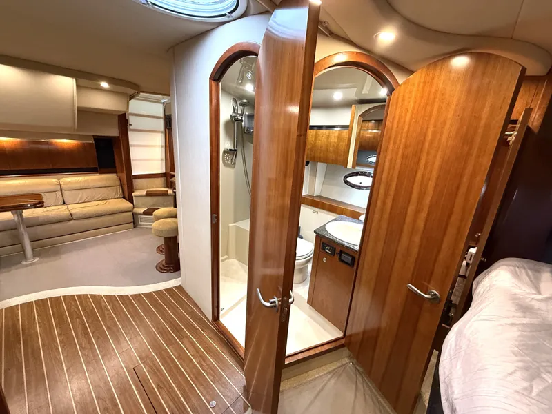 Slide: The Image of Interior of a 2008 Cruiser Yachts 420 with wood paneling and modern amenities. - 32