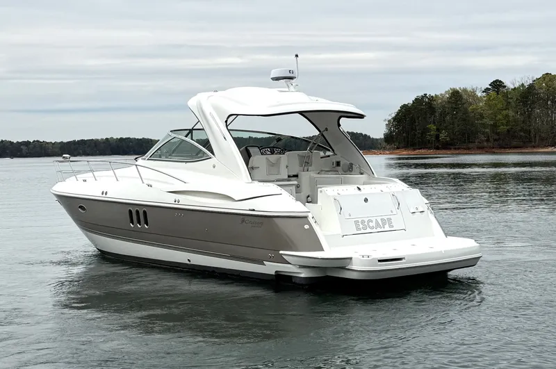 Slide: The Image of 2008 Cruiser Yachts 420 on calm water, wooded shoreline in background. - 4