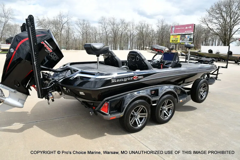 Slide: The Image of 2025 Ranger Z520R Cup Equipped boat on trailer outdoors. - 20