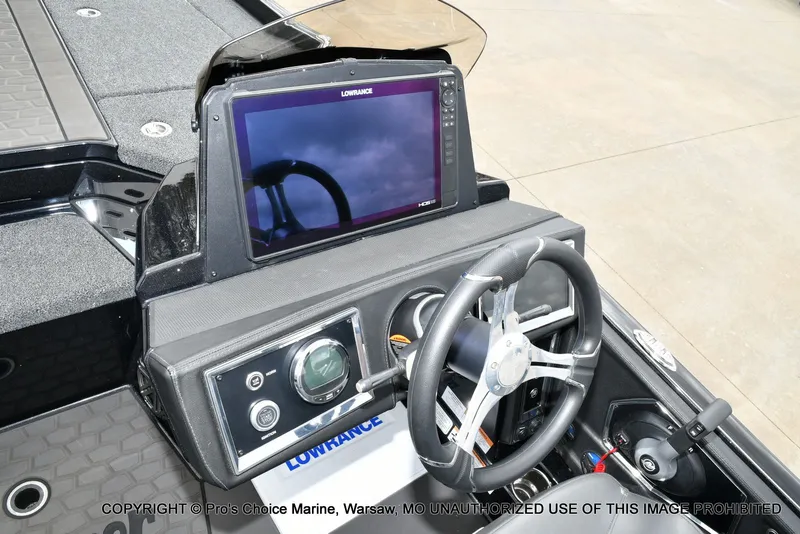 Slide: The Image of 2025 Ranger Z520R boat console with Lowrance display and steering wheel. - 47