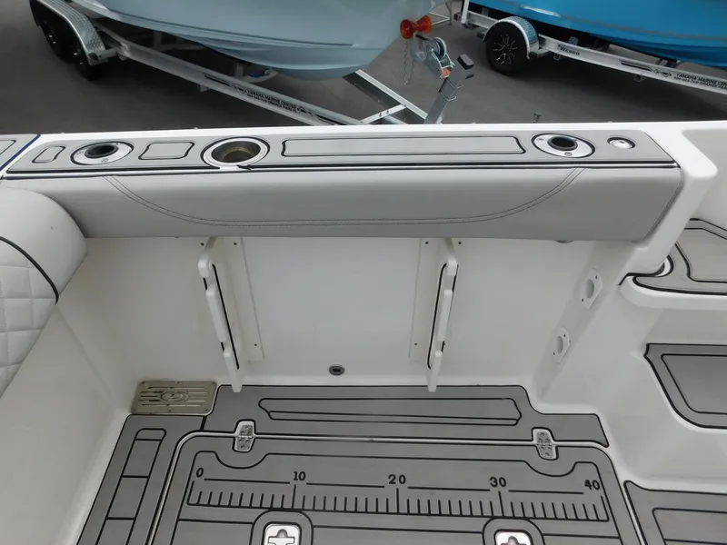 Slide: The Image of Interior of 2023 Pursuit OS 325 Offshore with rod holders. - 13