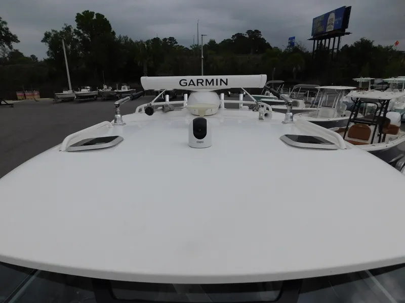 Slide: The Image of 2023 Pursuit OS 325 Offshore with Garmin equipment on deck. - 23