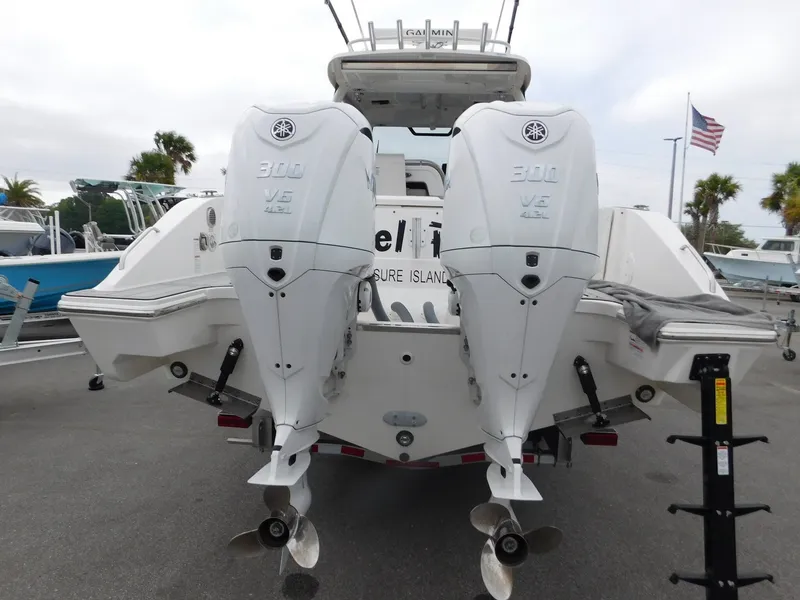 Slide: The Image of 2023 Pursuit OS 325 Offshore with dual outboard engines. - 7